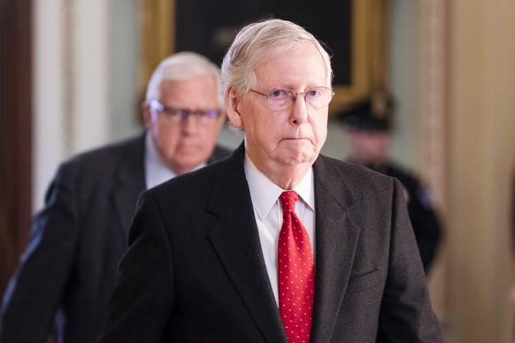 epa08148823 Republican Senate Majority Leader Mitch McConnell walks off the Senate floor after the start of the impeachment trial in the US Capitol in Washington, DC, USA, 21 January 2020. The first f ...