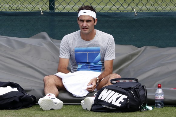 Roger Federer of Switzerland takes a break during a training session at the All England Lawn Tennis Championships in Wimbledon, London, Saturday, July 1, 2017. The Wimbledon Championships 2017 will be ...