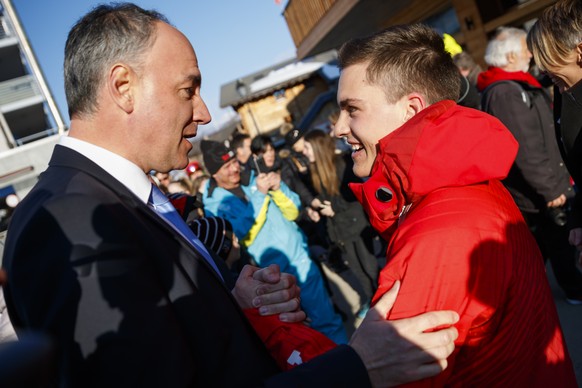 Christophe Darbellay, State Councillor of Valais (left) shakes hands with skier and triple paralympics gold medalist Theo Gmuer (right) during a welcoming event in Nendaz, Switzerland, Wednesday March ...