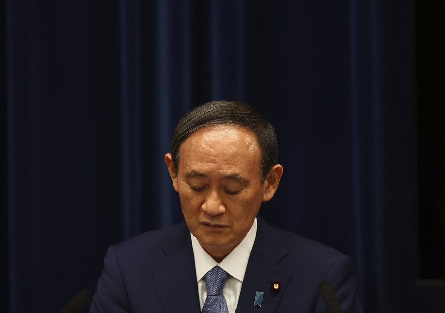 Japan&#039;s Prime Minister Yoshihide Suga attends a news conference on Japan&#039;s response to the coronavirus pandemic at his official residence during the Tokyo 2020 Olympic Games in Tokyo, Japan, ...