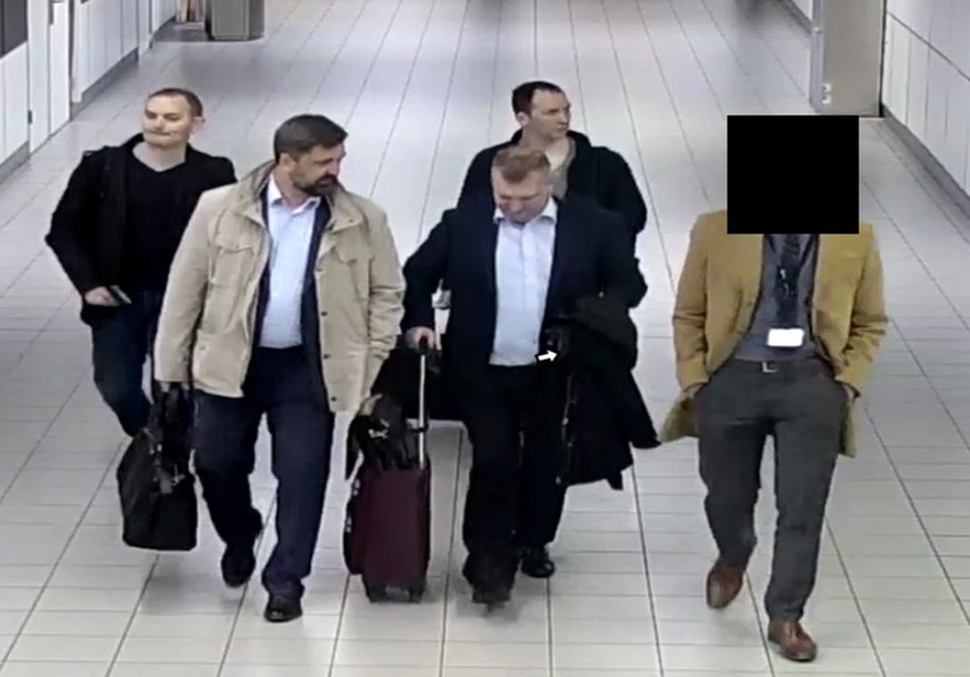 epa07069243 A handout photo made available on 04 October 2018 by the Dutch Ministry of Defense shows four Russian intelligence officers at Schiphol Airport, Amsterdam, the Netherlands, 04 October 2018 ...