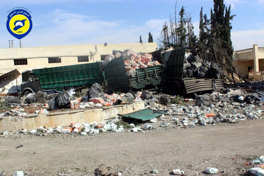 epa05549553 A handout picture made available by Syria Civil Defense volunteer group (The White Helmets) shows the remains of the humanitarian convoy organized by the Red Crescent and the Red Cross tha ...
