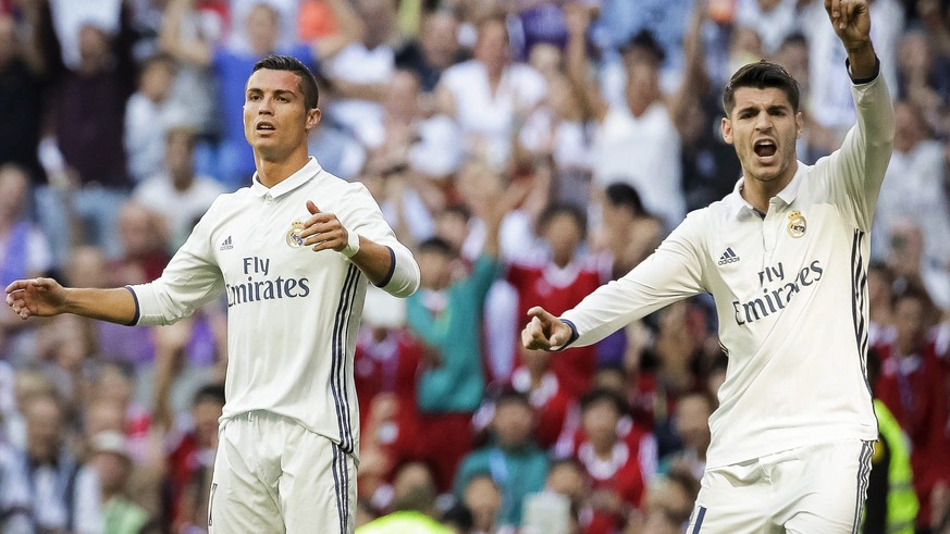 epa05566918 Real Madrid&#039;s Portuguese striker Cristiano Ronaldo (L) and Spanish striker Alvaro Morata (R) react during the Spanish Primera Division soccer match between Real Madrid and SD Eibar at ...