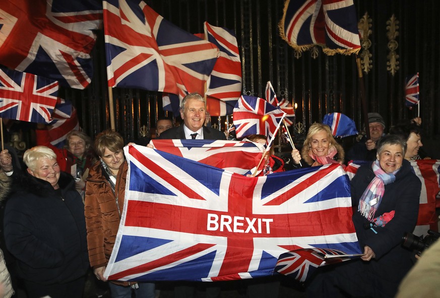 Brexit supporters celebrate during a rally outside Stormont in Belfast, Northern Ireland as Britain left the European Union on Friday, Jan. 31, 2020. Britain officially left the European Union on Frid ...