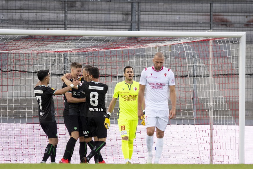St. Gallen&#039;s players, left, celebrate the 1 - 0 in front of Sion&#039;s goalkeeper Kevin Fickentscher, center, and Sion&#039;s midfielder Pajtim Kasami, right, during the first Super League socce ...