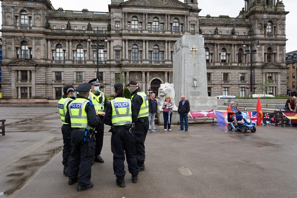 epa08512081 Police officers patrol on George Square following reports of a planned loyalist demonstration in Glasgow, Scotland, Britain, 27 June 2020. Only a very small group of loyalists sporting Uni ...