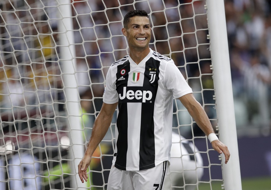 Juventus&#039; Cristiano Ronaldo smiles after his teammate Juventus&#039; Mario Mandzukic scored his sides second gaol of the game during the Serie A soccer match between Juventus and Lazio at the All ...