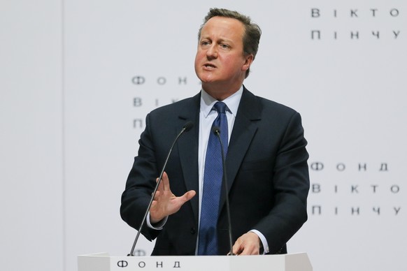 FILE - In this Wednesday, March 29, 2017 file photo Britain&#039;s former Prime Minister David Cameron gestures as he delivers a public lecture &quot;Ukraine&#039;s Place in a changing world&quot; at  ...