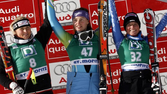 Tina Maze, of Slovenia, center, winner of an alpine ski, women&#039;s World Cup Downhill race, celebrates on the podium with second placed Maria Holaus, of Austria, left, and third placed Lara Gut, of ...