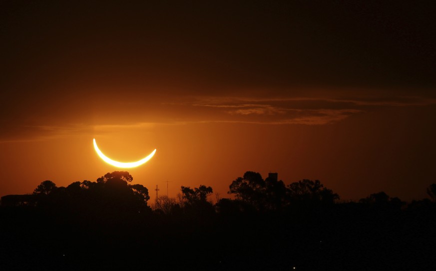 The moon passes in front of the setting sun during a total solar eclipse in Buenos Aires, Argentina, Tuesday, July 2, 2019. A solar eclipse occurs when the moon passes between the Earth and the sun an ...