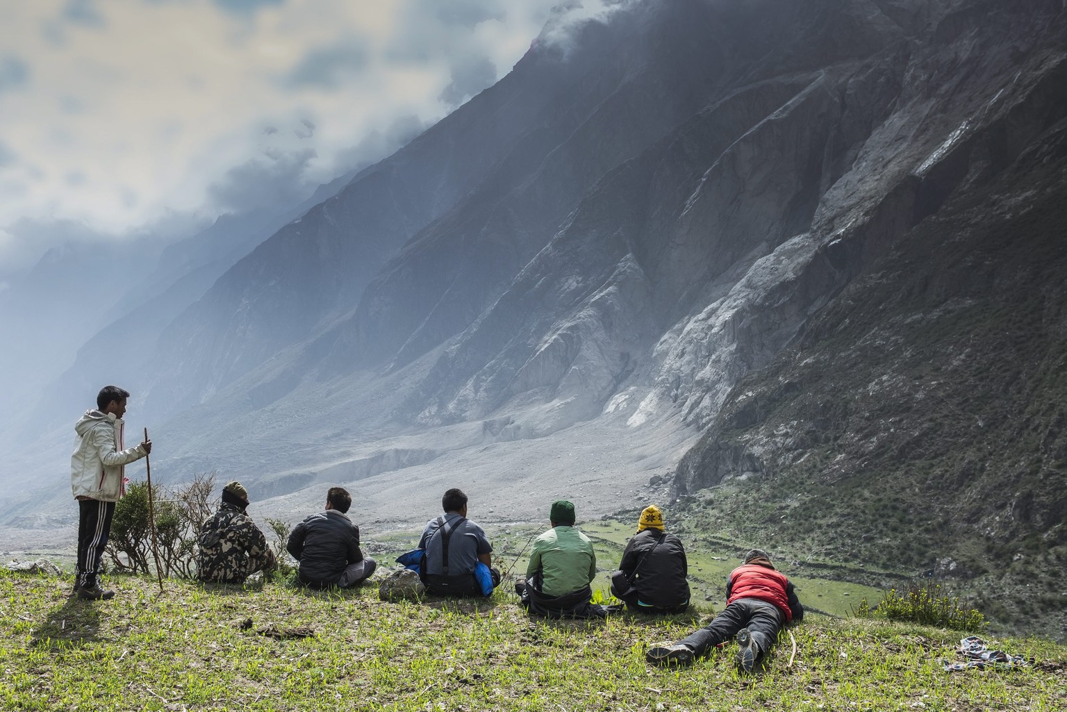 epa04789646 A picture made available 08 June 2015 shows local people watching the site of an landslide caused by an earthquake in Langtang valley, Nepal, 04 June 2015. Nepalese army have started a sea ...
