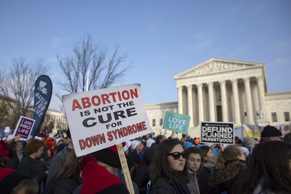 epa07298078 People participate in the anti-abortion March for Life rally at the US Supreme Court in Washington, DC, USA, 18 January 2019. The 46th annual pro-life March for Life protests against the U ...