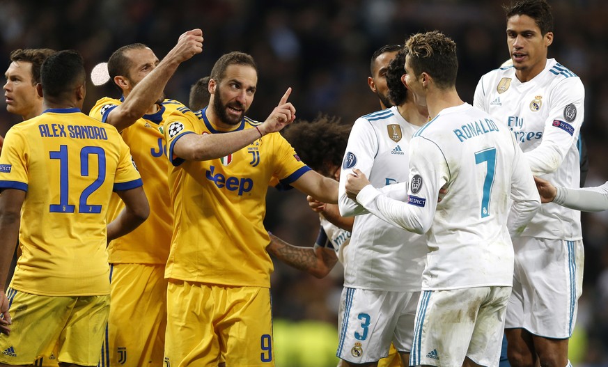 Real Madrid&#039;s Cristiano Ronaldo argues with Juventus&#039; Gonzalo Higuain during a Champions League quarter final second leg soccer match between Real Madrid and Juventus at the Santiago Bernabe ...