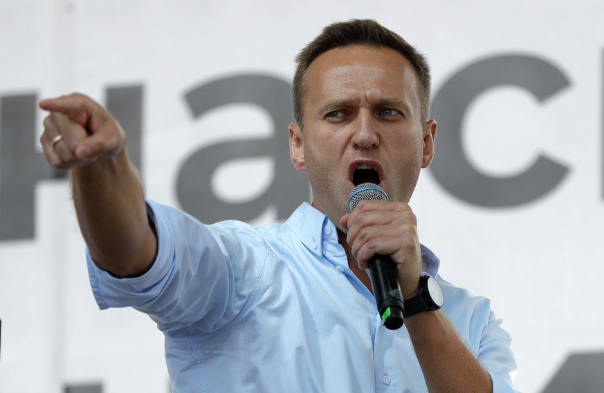 FILE - In this Saturday, July 20, 2019 file photo, Russian opposition activist Alexei Navalny gestures while speaking to a crowd during a political protest in Moscow, Russia. Russia&#039;s top diploma ...