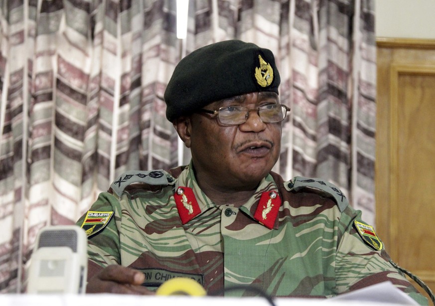 FILE -- In this Monday, Nov. 13, 2017, file photo, Zimbabwe&#039;s Army Commander, Constantino Chiwenga addresses a press conference in Harare. Armored personnel carriers were seen outside the capital ...
