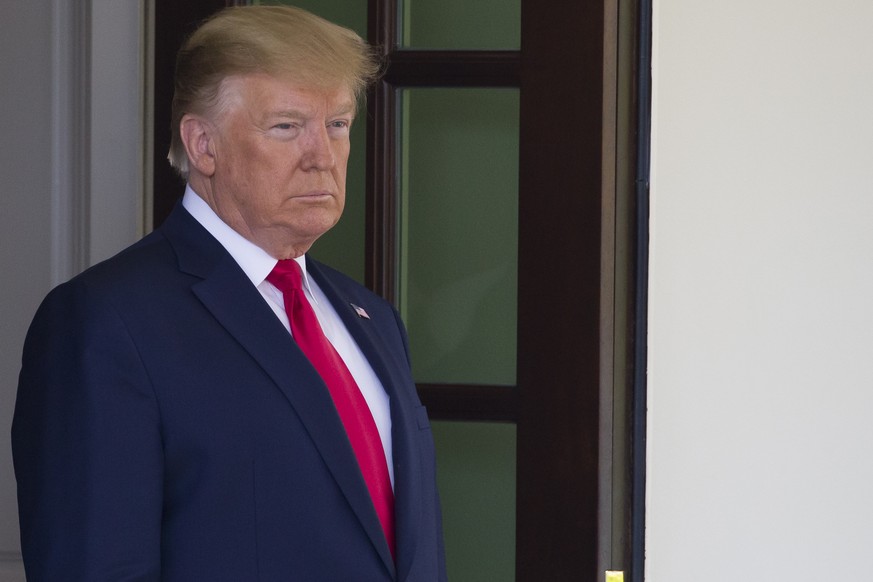 President Donald Trump listens to reporter&#039;s questions as he waits for the arrival Qatar&#039;s Emir Sheikh Tamim bin Hamad Al Thani at the White House, Tuesday, July 9, 2019, in Washington. (AP  ...
