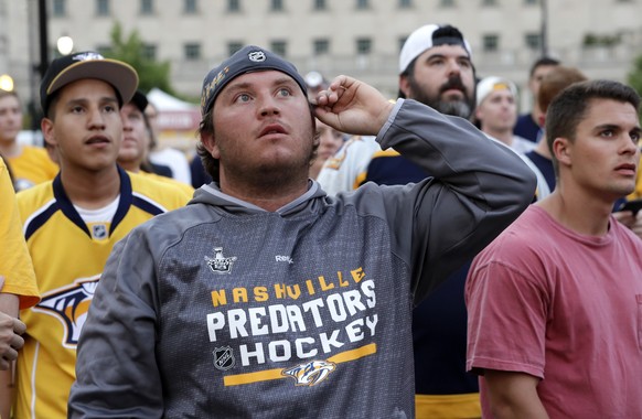 Nashville Predators fans watch the Predators play the Pittsburgh Penguins in Game 1 of the NHL Stanley Cup Finals at one of several viewing areas set up Monday, May 29, 2017, in Nashville, Tenn. (AP P ...