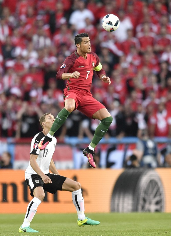Portugal&#039;s Cristiano Ronaldo jumps for the ball during the Euro 2016 Group F soccer match between Portugal and Austria at the Parc des Princes stadium in Paris, France, Saturday, June 18, 2016. ( ...