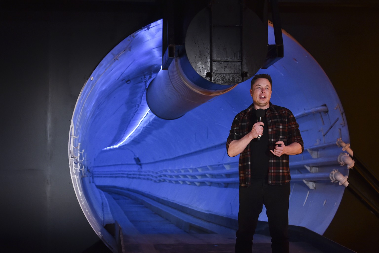 Elon Musk, co-founder and chief executive officer of Tesla Inc., speaks during an unveiling event for the Boring Co. Hawthorne test tunnel in Hawthorne, Calif., on Tuesday, Dec. 18, 2018. Musk has unv ...