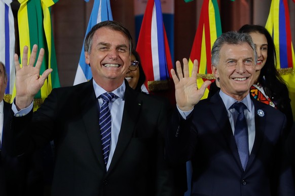 epa07723133 Argentinian President Mauricio Macri (R) and Brazilian President Jair Bolsonaro pose during the Mercosur Summit, held at the Belgrano Station, in Santa Fe, Argentina, 17 July 2019. EPA/Jua ...