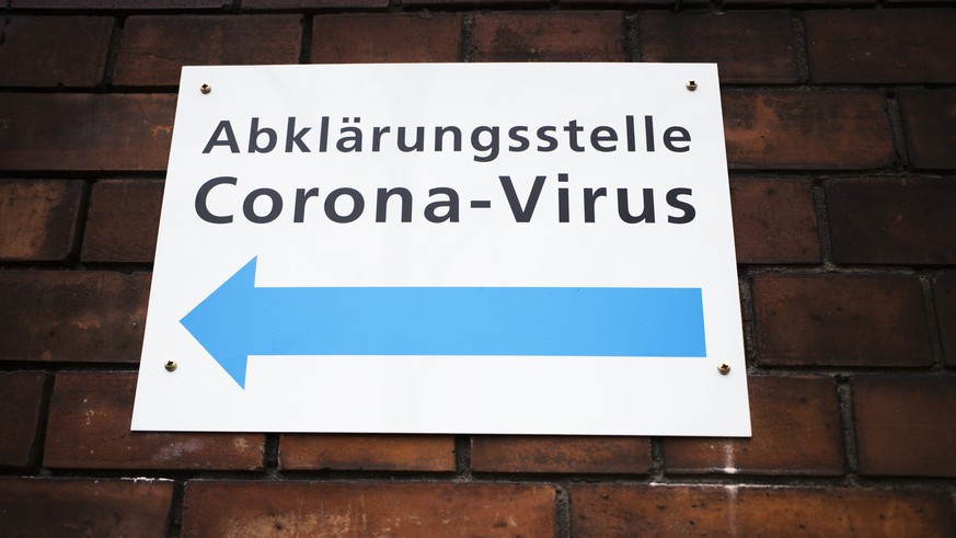An information sign displayed at the wall of an hospital directing to a new set up test and information centre for the new coronavirus at the district Prenzlauer Berg in Berlin, Germany, Monday, March ...