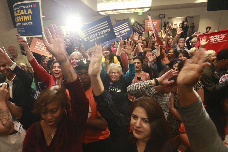 Democratic supporters cheer their candidates at a Democratic Party event in Richmond, Va., Tuesday, Nov. 5, 2019. All seats in the Virginia House of Delegates and state Senate are up for election. (AP ...