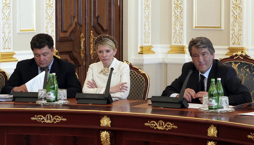 8. September, 2005: Wiktor Juschtschenko (rechts) mit&nbsp;Julija Timoschenko und Petro Poroschenko.