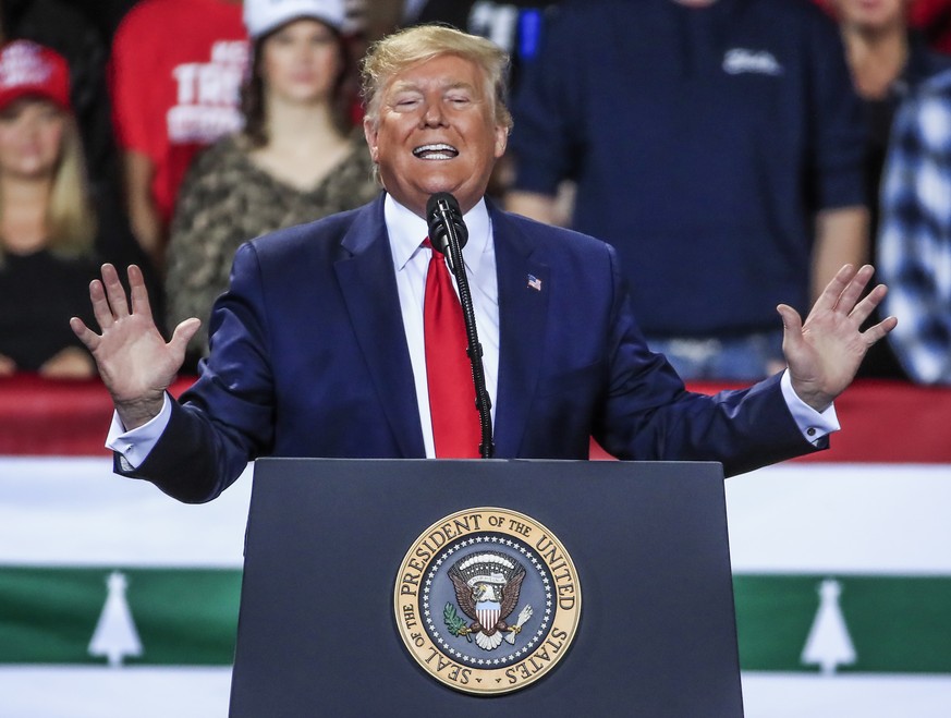 epa08080827 US President Donald J. Trump addresses supporters during his Christmas Rally at the Kellogg Arena in Battle Creek, Michigan, USA, 18 December 2019. The majority of the House voted on 18 De ...