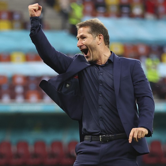Austria&#039;s manager Franco Foda celebrates after the Euro 2020 soccer championship group C match between Ukraine and Austria at the National Arena stadium in Bucharest, Monday, June 21, 2021. (Mark ...