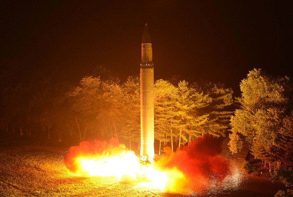 This Friday, July 28, 2017, photo distributed by the North Korean government on Saturday, July 29, 2017, shows what was said to be the launch of a Hwasong-14 intercontinental ballistic missile at an u ...
