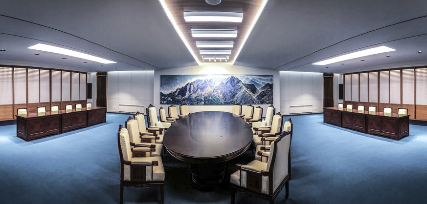 This April 23, 2018 photo provided by South Korea Presidential Blue House on Wednesday, April 25, 2018, shows a meeting room for the upcoming a summit between South and North Korea at the Peace House  ...