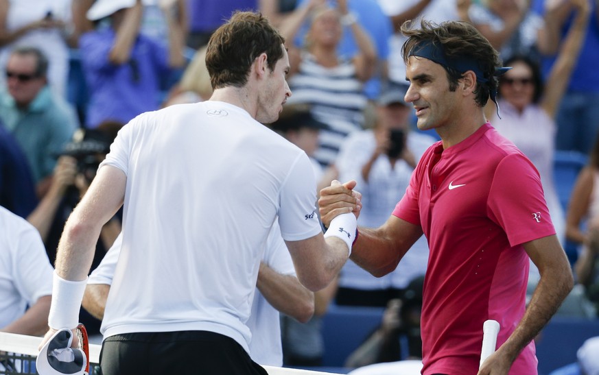 Roger Federer, of Switzerland, right, shakes hands with Andy Murray, of Great Britain, after winning their semifinal match at the Western &amp; Southern Open tennis tournament, Saturday, Aug. 22, 2015 ...