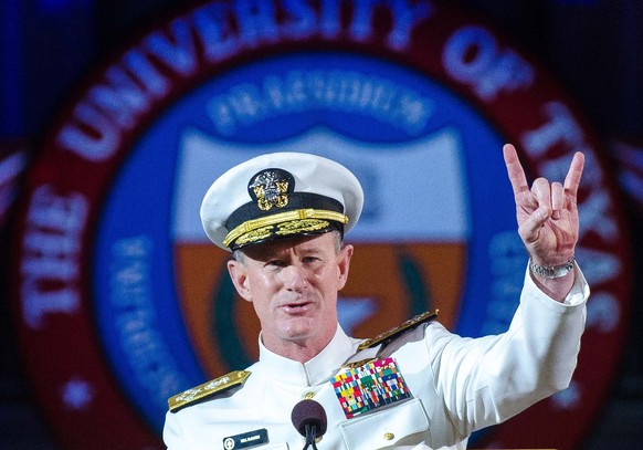 FILE - In this May 17, 2014 file photo Naval Adm. William H. McRaven, an alumnus, does the Longhorns&#039; Hook &#039;em Horns hand signal during his commencement keynote address at the University of  ...