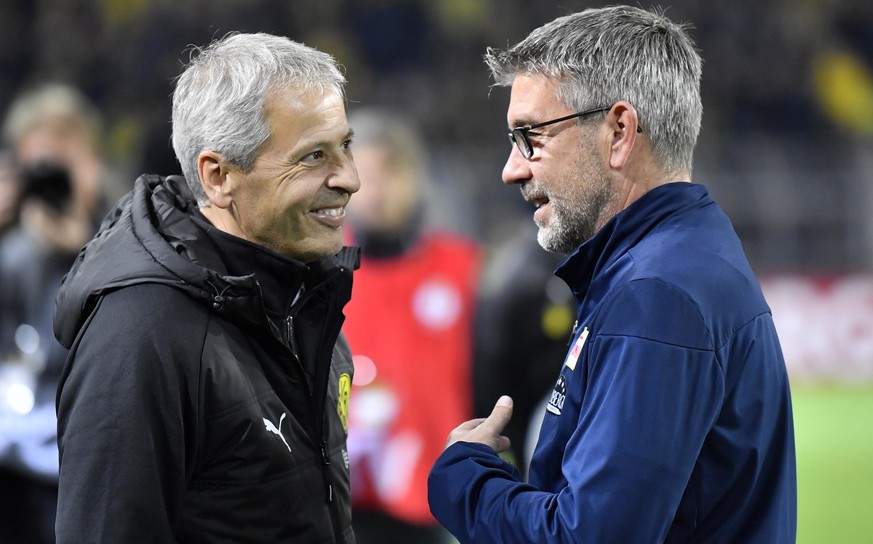 Dortmund coach Lucien Favre, left, talks with Union&#039;s head coach Urs Fischer, right, prior the German soccer cup, DFB Pokal, match between Borussia Dortmund and second division club Union Berlin  ...