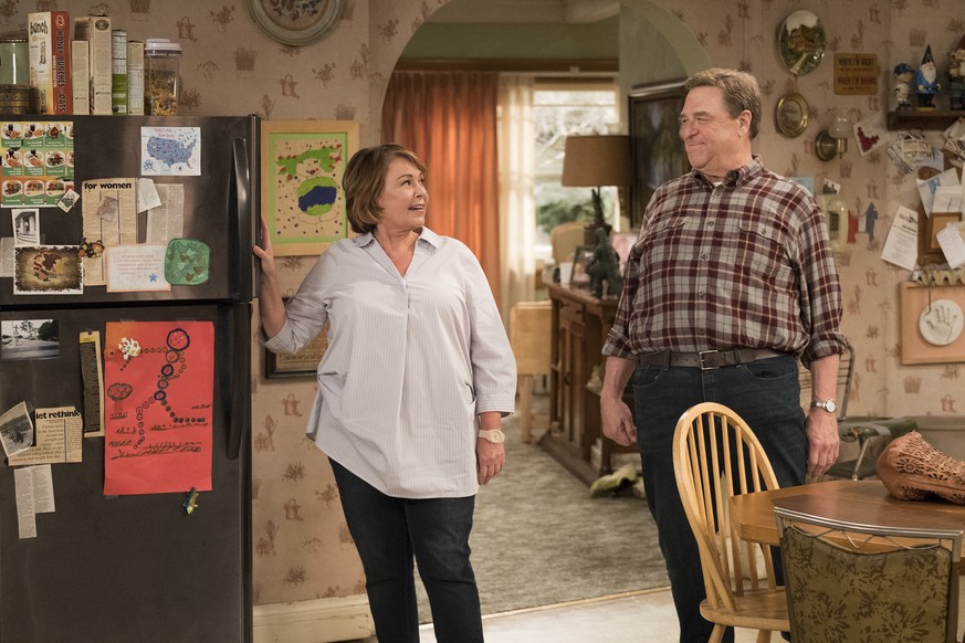 This image released by ABC shows Roseanne Barr, left, and John Goodman in a scene from the comedy series &quot;Roseanne.&quot; Expect &quot;Roseanne&quot; to cool it on politics and concentrate on fam ...