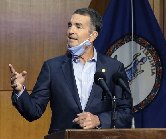 FILE - In this Sept. 1, 2020, file photo, Virginia Gov. Ralph Northam answers a reporter&#039;s question during a news briefing in Richmond, Va. Members of anti-government paramilitary groups discusse ...