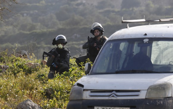 epa08285436 Israeli troops during clashes with Palestinian protesters at Beta village near the West Bank city of Nablus, 11 March 2020. According to media reports, 20 Palestinians were wounded, three  ...