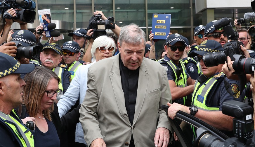 epa08346431 (FILE) - Australian Cardinal George Pell (C) leaves the County Court in Melbourne, Victoria, Australia, 26 February 2019 (reissued 06 April 2020). The Australian high court on 07 April 202 ...