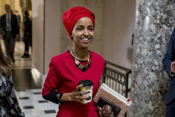 FILE - In this Jan. 16, 2019 file photo, Rep. Ilhan Omar, D-Minn., walks through the halls of the Capitol Building in Washington. In Omar&#039;s Minnesota district, both Jews and Muslims voiced concer ...