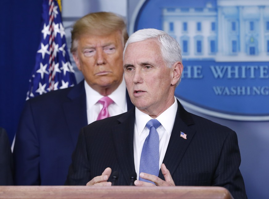 epa08251042 US President Donald J. Trump (L) as US Vice President Mike Pence speaks to the media in the James S. Brady Briefing room with members of the Coronavirus Task Force at the White House in Wa ...