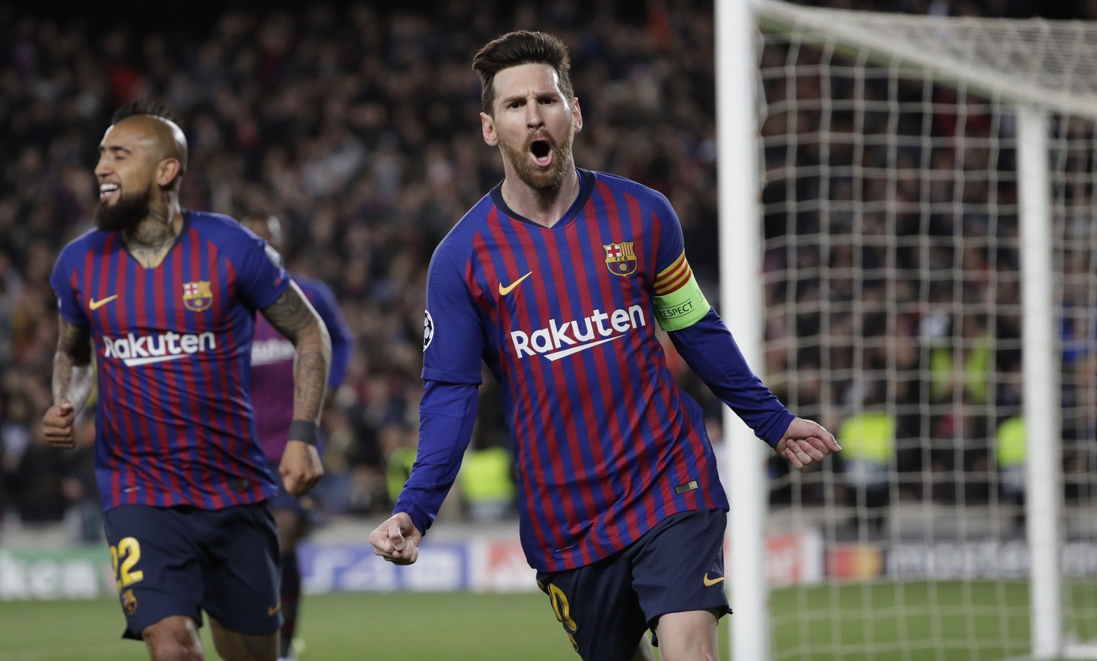 Barcelona&#039;s Lionel Messi, right, celebrates after scoring his side&#039;s third goal during the Champions League round of 16, 2nd leg, soccer match between FC Barcelona and Olympique Lyon at the  ...