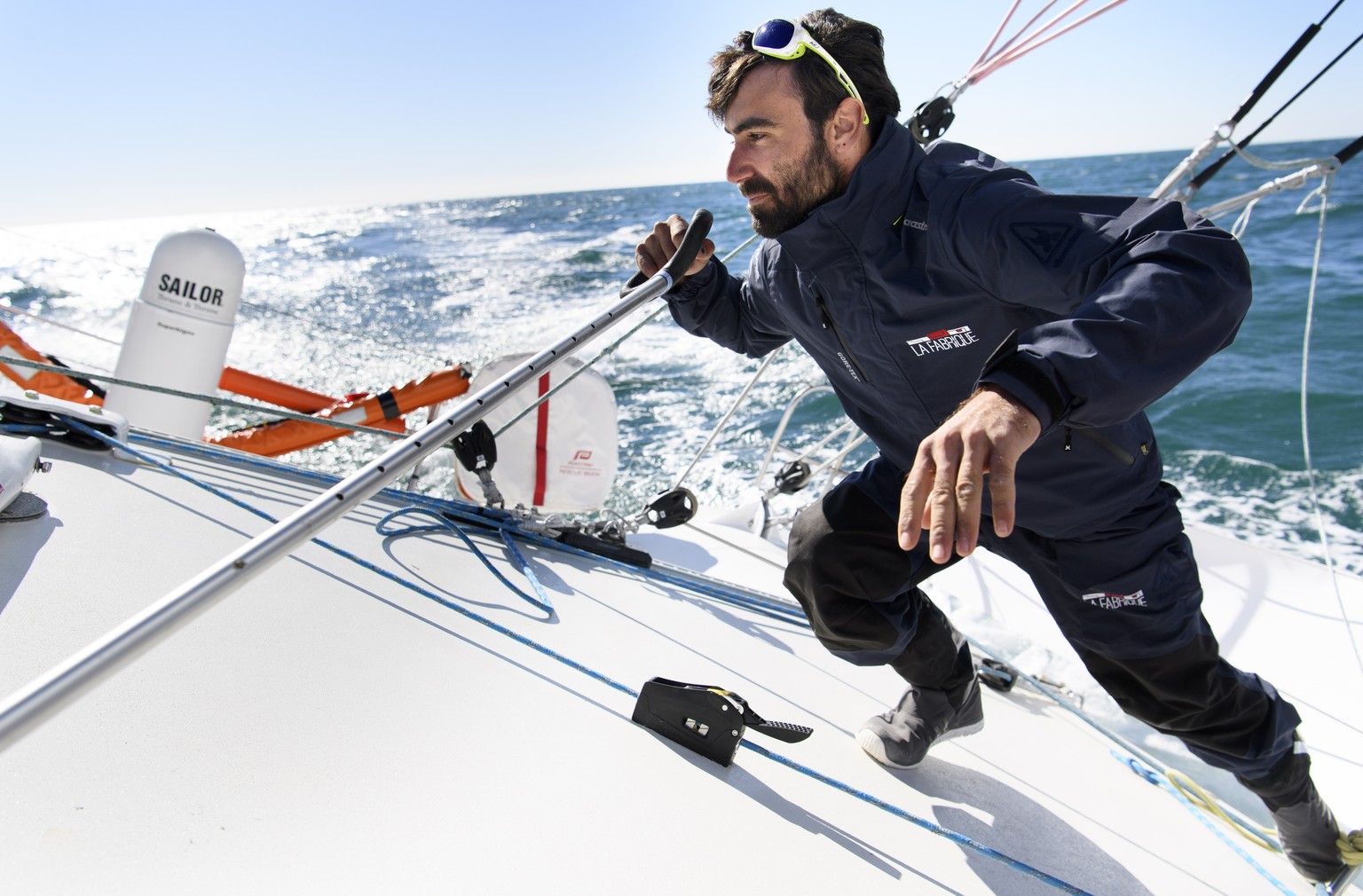 Swiss skipper Alan Roura works onboard of the monohull IMOCA &quot;La Fabrique&quot; SUI7 during a training session one month before the start of the Vendee Globe sailing race, at the western French h ...