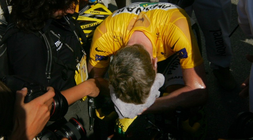 Floyd Landis of the USA, who lost the overall leader&#039;s yellow jersey, recovers after crossing the finish line of the 16th stage of the 93rd Tour de France cycling race between Bourg d&#039;Oisans ...