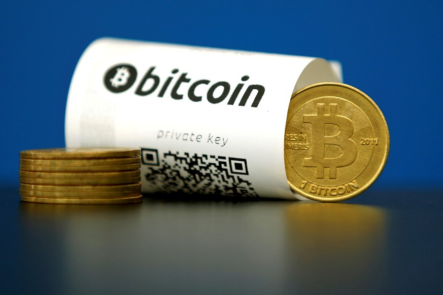 FILE PHOTO - A Bitcoin (virtual currency) paper wallet with QR codes and a coin are seen in an illustration picture taken at La Maison du Bitcoin in Paris, France, May 27, 2015. To match Special Repor ...