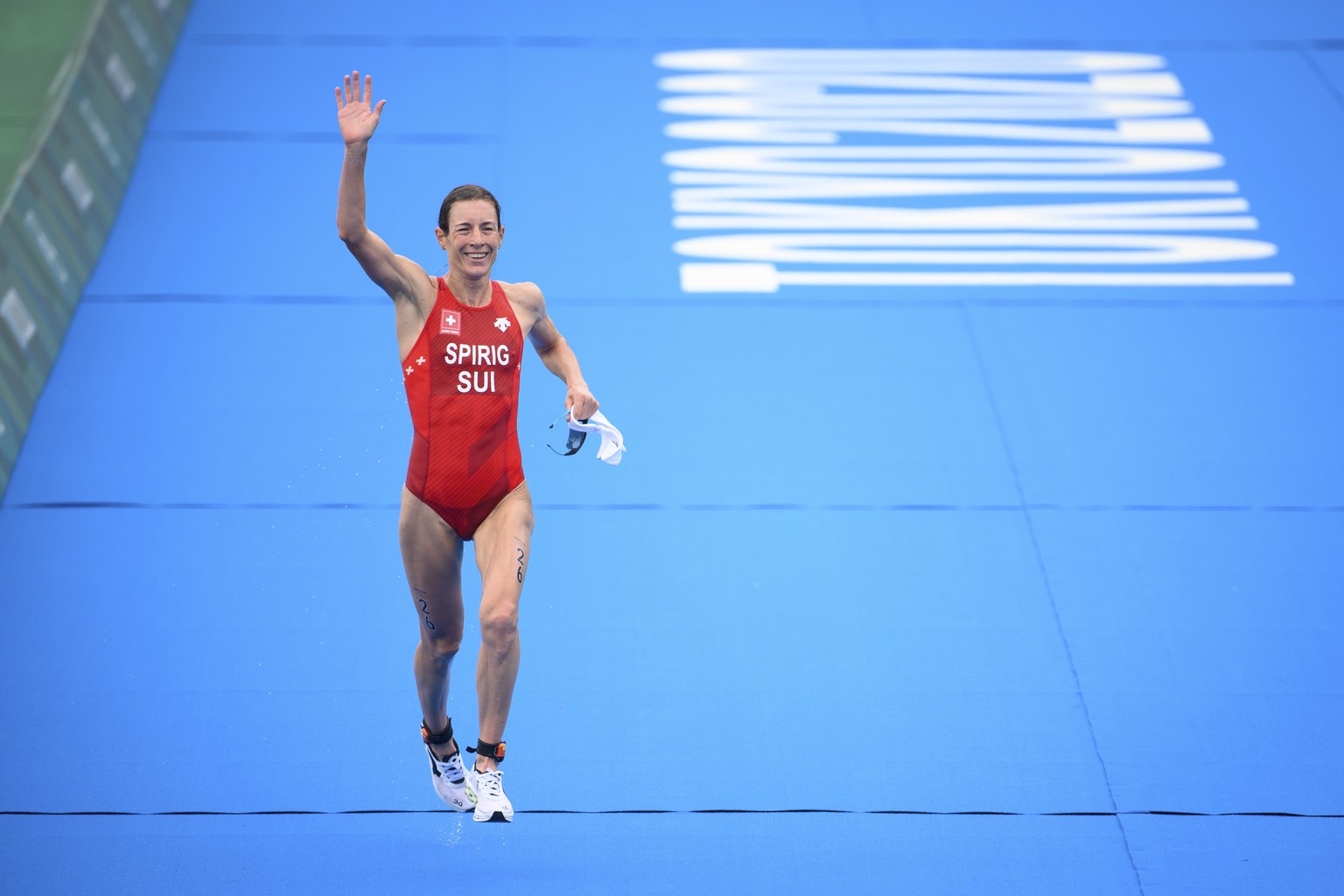 Nicola Spirig of Switzerland reacts as she cross the finish line of the women&#039;s individual triathlon competition at the 2020 Tokyo Summer Olympics in Tokyo, Japan, on Tuesday, July 27, 2021. (KEY ...