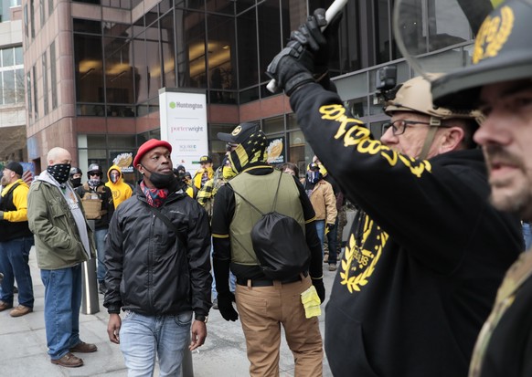 Members of the Proud Boys and counter protesters engage with each other during a rally on Wednesday, Jan. 6, 2021, at the Ohio Statehouse in Columbus, Ohio. Hundreds of supporters of President Donald  ...