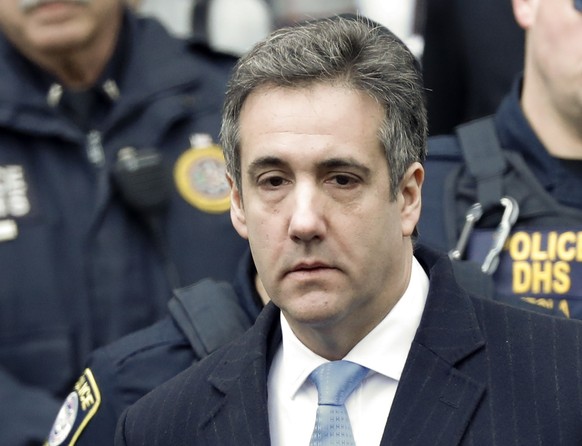 epa07226493 Michael Cohen, President Trump&#039;s former lawyer, departs United States Federal Court under heavy security after being sentenced to three years in prison in New York, New York, USA, 12  ...