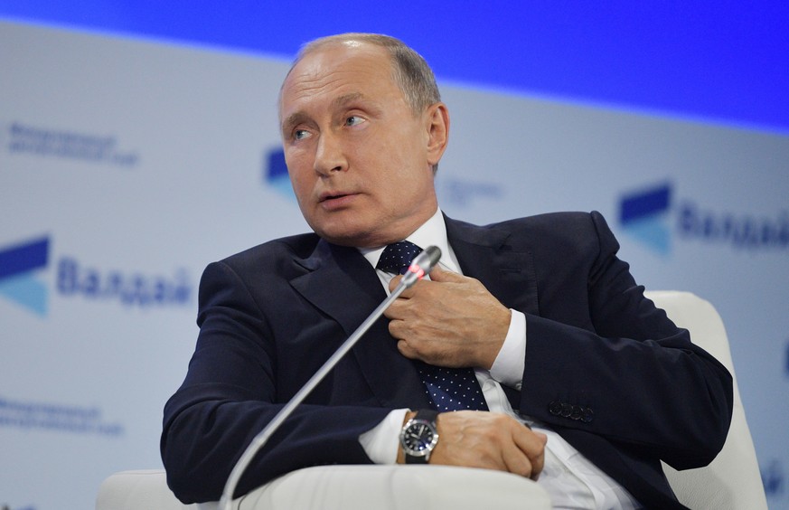 epa07102219 Russian President Vladimir Putin attends a plenary session of the 15th anniversary meeting of the Valdai International Discussion Club in the Black sea resort of Sochi, Russia, 18 October  ...