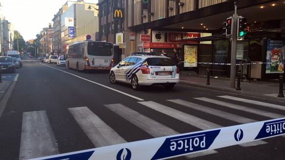 Police secure the scene around a bus stop after a knife attack in Brussels on Monday, Aug. 22, 2016. A knife-wielding woman stabbed three people in Brussels on Monday and was later shot by police when ...