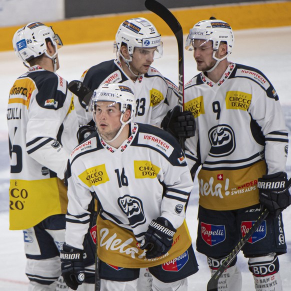 From left, Ambri&#039;s player Dominic Zwerger, Ambri&#039;s player Marco Mueller and Ambri&#039;s player Dario Rohrbach, celebrate 2-2 gool, during the frendly match of National League A (NLA) Swiss  ...